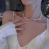 Elegant Pearl Necklace with Diamond Bow Pendant