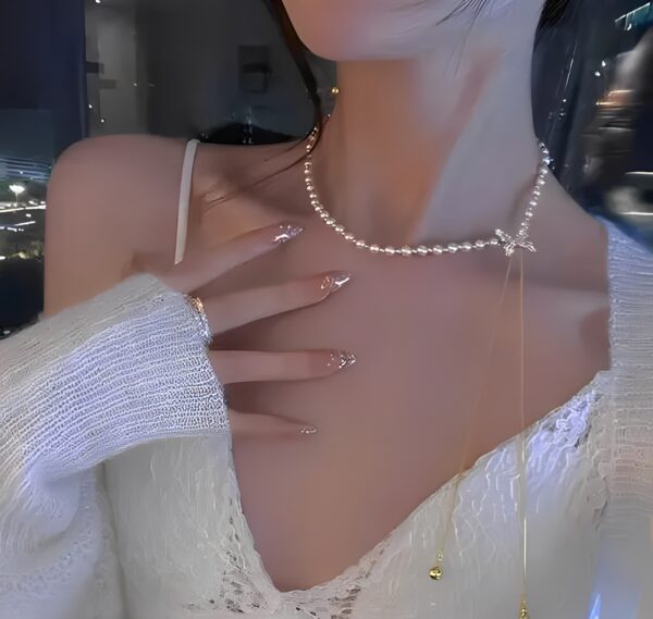 Elegant Pearl Necklace with Diamond Bow Pendant