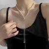 Elegant Pearl Necklace with Diamond Bow Pendant