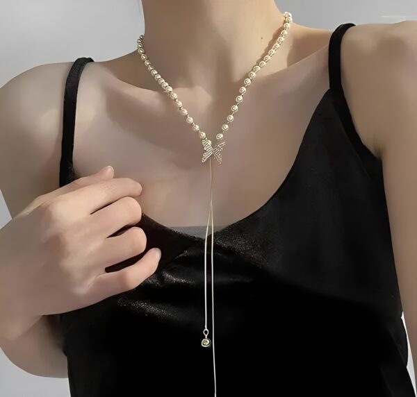 Elegant Pearl Necklace with Diamond Bow Pendant
