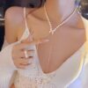 Elegant Pearl Necklace with Diamond Bow Pendant